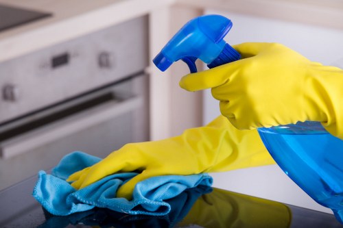 Carpet cleaning team preparing equipment safely in a home