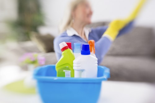 Technician using carpet cleaning tools with protective gear